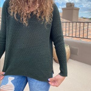 Green knitted sweater